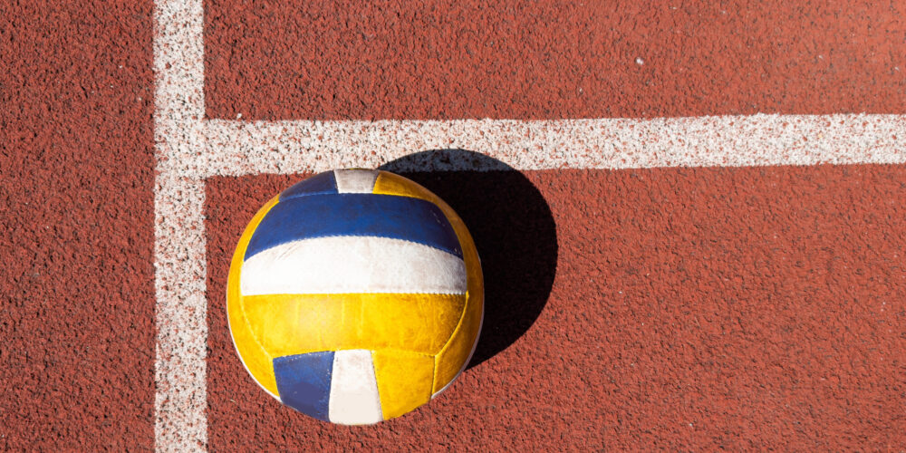 volleyball. blue with yellow color ball on the playground. volleyball cover, red. ball game. High quality photo