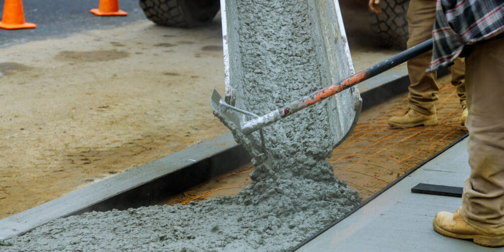 Worker working for concrete pavement for ground flooring at construction